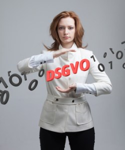 DSGVO, german version of GDPR, concept image. General Data Protection Regulation, protection of personal data. Young woman working with information. Datenschutz-Grundverordnung.