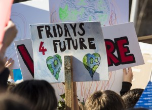 Protestors holding climate change banners at a protest